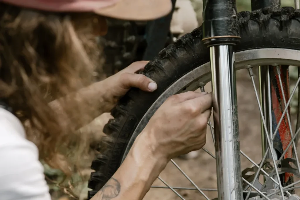 Rider working on an off-road motorbike