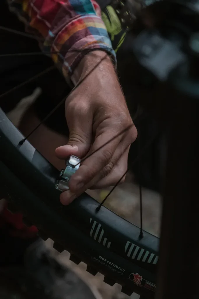 Mechanic servicing an off-road vehicle wheel