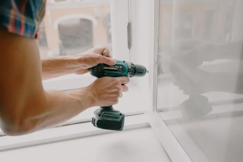 Automatic door operator installation hardware being fitted to door frame