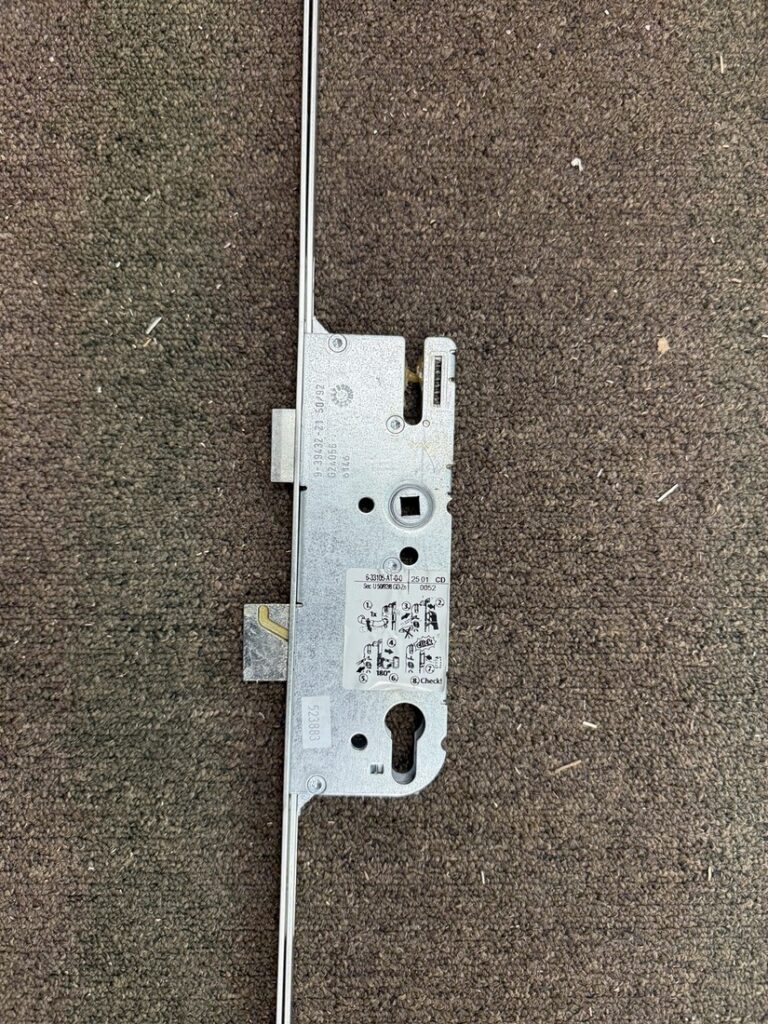 Full-length multipoint locking strip on a white French patio door during repair service